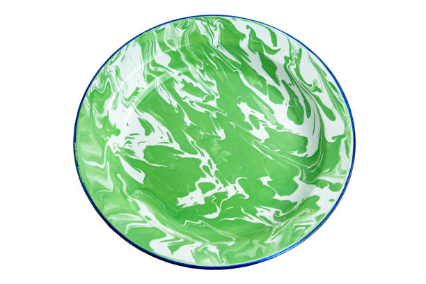istock An old indonesian plate with green stripes on a white background. 2202203238