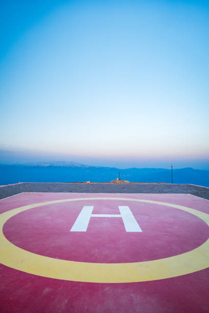 Helipad on mountain top, helicopter landing site on hill area