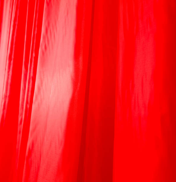 istock A red curtain is hanging in the air 2202207451