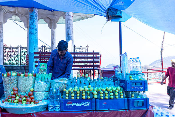 Naina Devi, Himachal Pradesh, India - March 2022: View of local market at naina devi with shopkeeper at shop selling their products. Naina devi is a holy place to worship goddess naina devi.