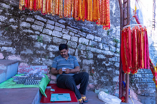 Naina Devi, Himachal Pradesh, India - March 2022: View of local market at naina devi with shopkeeper at shop selling their products. Naina devi is a holy place to worship goddess naina devi.
