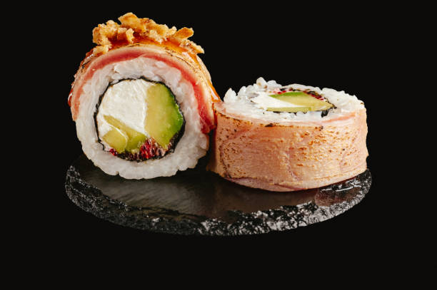 istock traditional Japanese sushi on a black background 2202209216