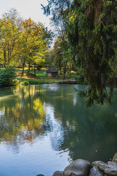 istock Tranquil lake reflects autumn colors in peaceful natural setting 2202209390