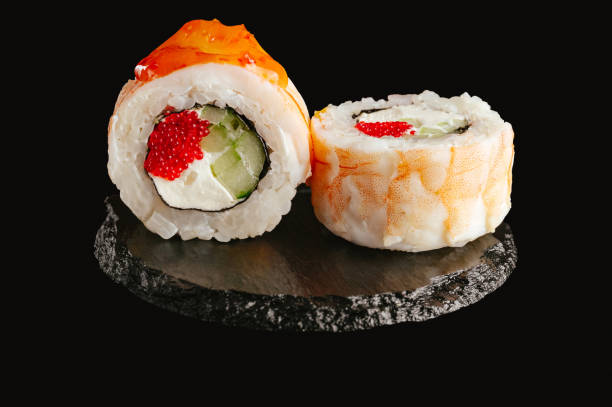 istock traditional Japanese sushi on a black background 2202209417