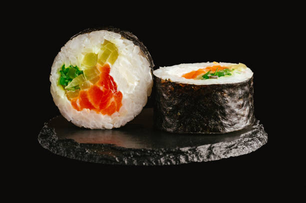 istock traditional Japanese sushi on a black background 2202210384