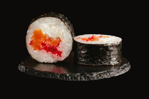 istock traditional Japanese sushi on a black background 2202210391