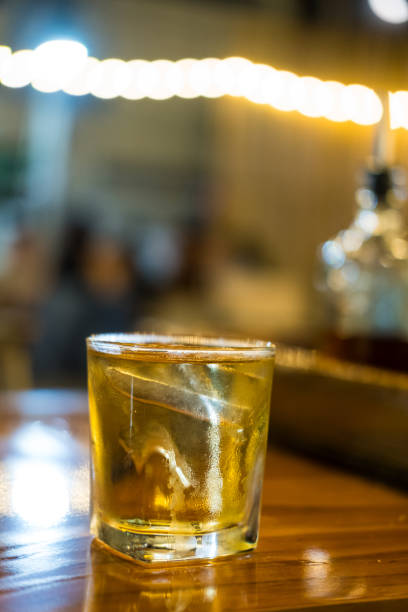 istock Glass of whiskey with ice 2202210657