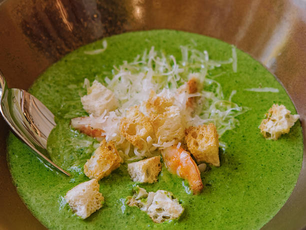 Gourmet spinach soup with shrimp and croutons