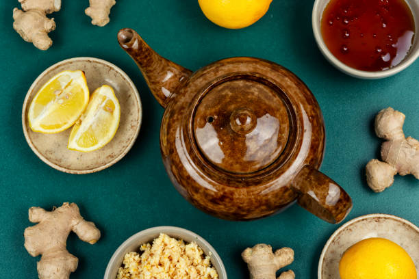 istock Ginger tea with limes in a glass teapot. 2202212841