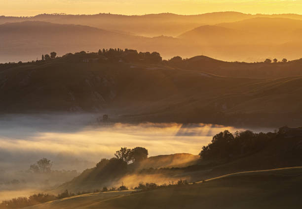istock Sunrise in Tuscany: Misty Valleys and Rolling Hills at Dawn 2202213535