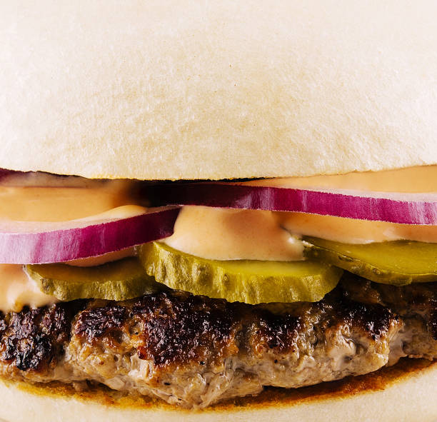 Gourmet burger with sauces and pickles