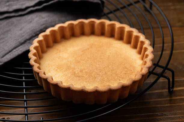 istock Cookie Tart on a Cake Cooler on Wooden Table 2202215691