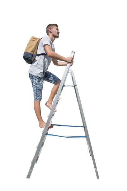 Man traveler climbing a ladder carrying a backpack looking away isolated on transparent background