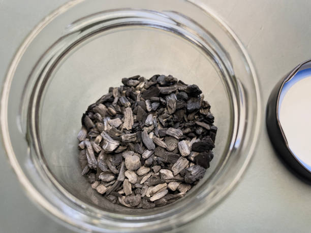 istock Close-up of biochar, produced through wood pyrolysis, a sustainable solution for carbon sequestration. Ideal for themes around CO2 reduction, climate change, and eco-friendly technology. 2202224206