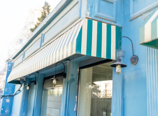 istock Vintage Blue Storefront with Striped Awning 2202228388