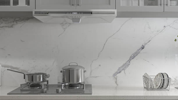 istock Modern Minimalist Kitchen with Marble Backsplash and Stainless Steel Cookware 2202228829