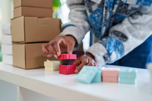 istock Young woman holding a small gift box. 2202232373