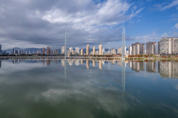 istock City buildings reflected on the lake water 2202233219