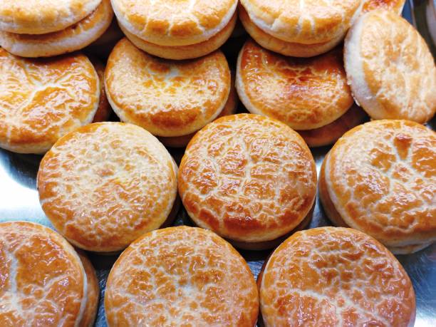 Sweetheart cake , Wife cake: wheat pastry with sweet chewy wintermelon & coconut filling.