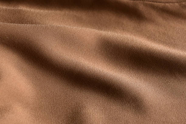 istock golden wollycrepe fabric as the background. 2202234157