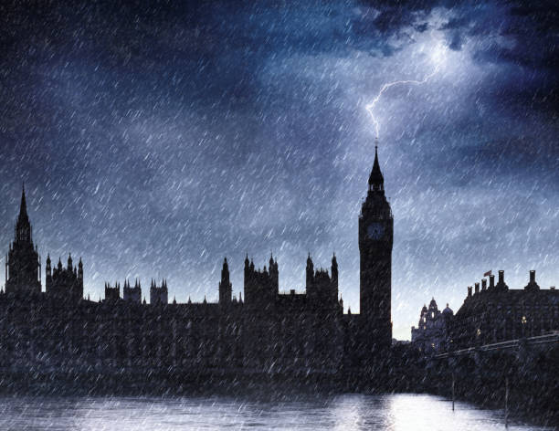 This dramatic image captures the iconic silhouette of Big Ben and the Houses of Parliament in London during a powerful thunderstorm. The scene is dominated by a dark, stormy sky with a flash of lightning illuminating the rain-soaked cityscape. Heavy rain streaks across the frame, creating a sense of drama and intensity. The silhouette of the historic buildings stands stark against the turbulent sky, emphasizing their grandeur and resilience. This photo evokes a sense of awe and the raw power of nature, making it ideal for themes related to travel, weather, and urban landscapes, particularly those with a dramatic or moody aesthetic.