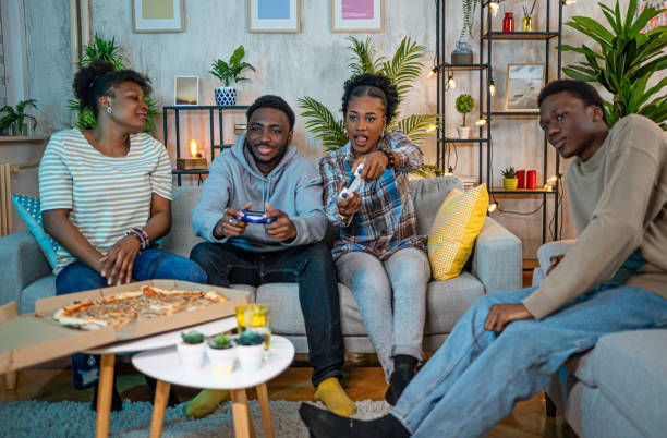 istock Friends playing video games at the apartment 2202238896