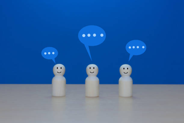 istock Communication, Meeting, Teamwork, Businessman Wooden Doll with Speech Bubble 2202240354