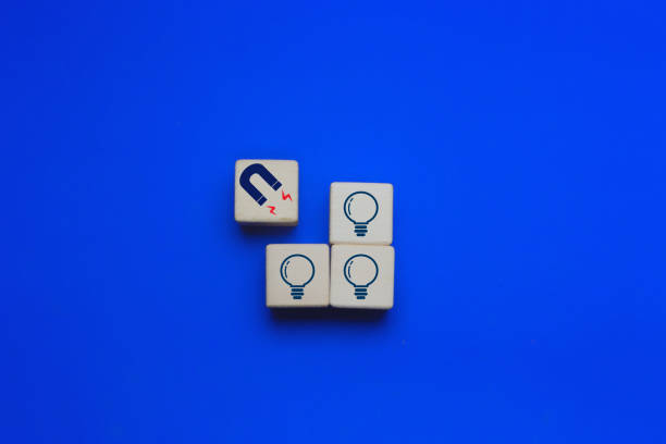 istock Magnets are attracting creative light bulbs, innovative concept 2202240645