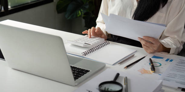 istock Accountant calculating financial data and preparing reports at a modern office desk. 2202241040