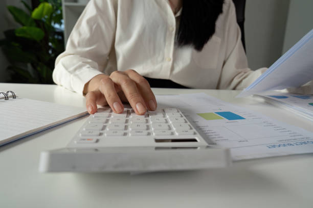 istock Professional accountant preparing tax documents using a calculator and financial reports. 2202241076