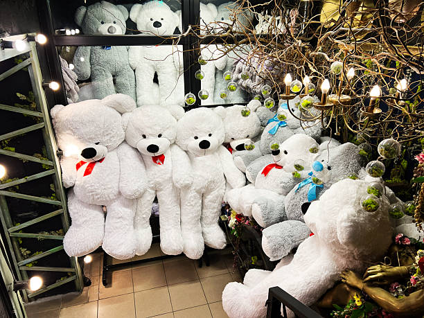 Cozy arrangement of oversized stuffed teddy bears surrounded by decorative elements and lights