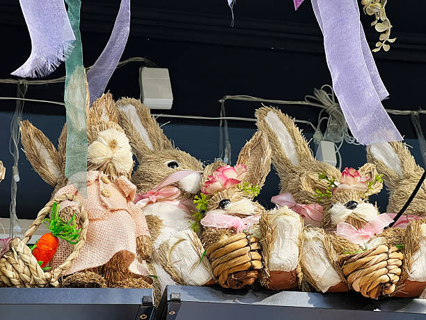 istock Decorative Clay Bunny Figures with Spring Flowers and Festive Ribbons for Easter 2202241575