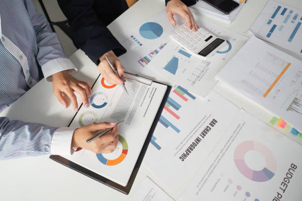 istock Accountants discussing budget strategies and financial reports in a collaborative workspace. 2202242011