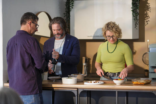 istock Friends Preparing a Fresh Dinner Together | Cooking, Bonding & Healthy Eating 2202243801