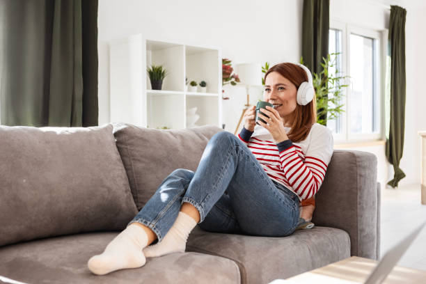 istock Young Woman Enjoying a Music Break With Coffee 2202244576