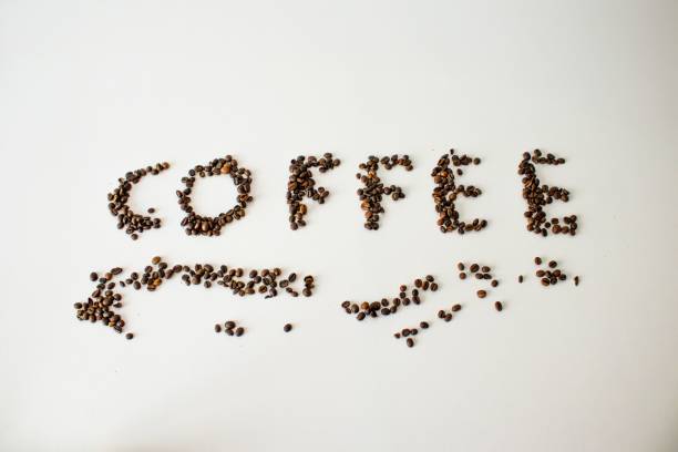 istock Coffee beans arranged to spell 'coffee' on a white background 2202245286