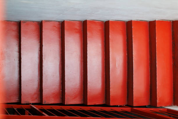 Bright red wooden steps leading to a terrace in a modern building during daylight