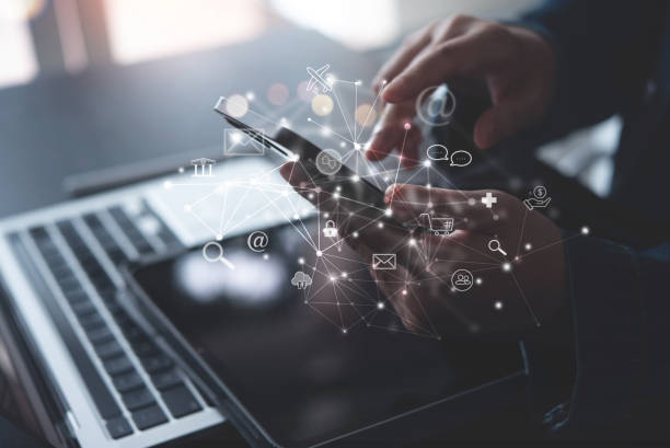 istock Internet of Things IoT, E-commerce concept. Woman using mobile phone with internet network connection via mobile apps, digital marketing, online shopping and mobile banking 2202252489