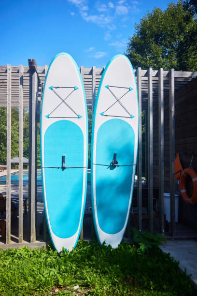 istock Two surfboards are leaning against the fence. 2202254226