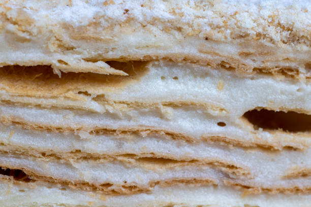 istock layered cake with white sweet cream on a board 2202258078