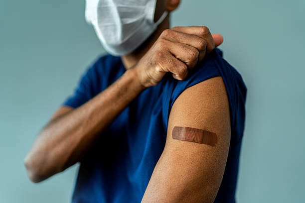 istock Man's arm with a bandage on a studio shot 2202258246