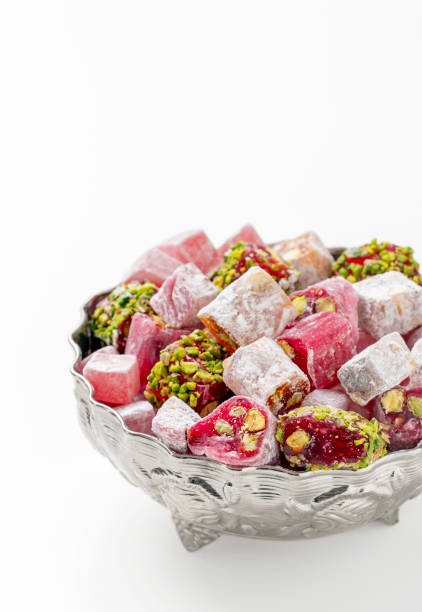 Turkish delight in traditional bowl over white background, Close up