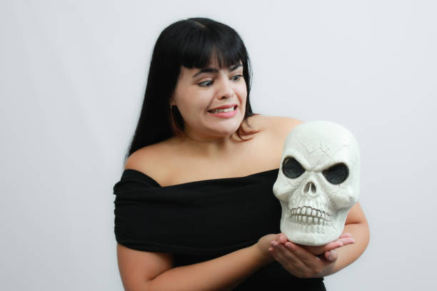 Concept of fear, mystery, Halloween, horror or theater. Copy space available on white background.