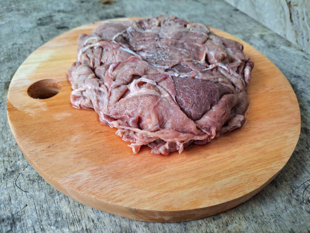 Yummy Raw Beef Meat On A Wooden Cutting Board.