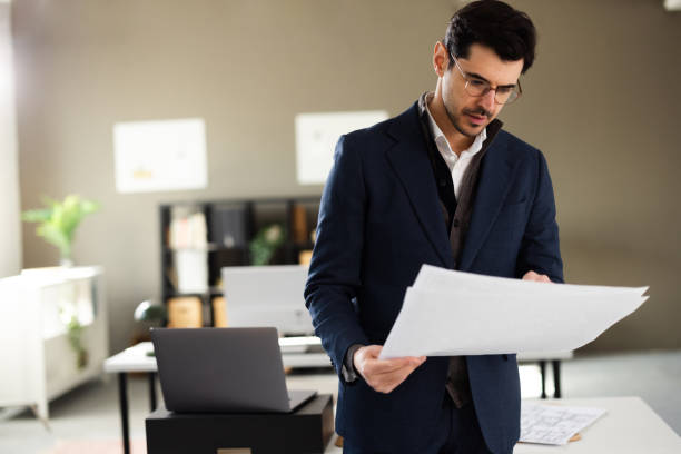istock The architect is designing a building layout in his office 2202261323