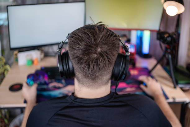 istock Professional gamer streaming live, playing video games on computer 2202261664