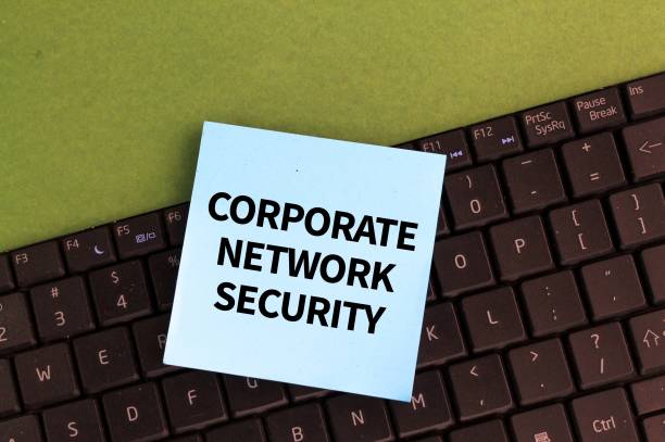 istock laptop keyboard and colored paper with the words corporate network security 2202262227