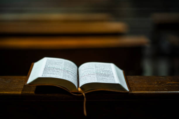 istock Open Bible on Wooden Church Lectern 2202266466