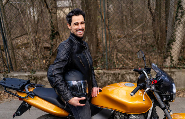 istock Man in leather jacket on motorcycle 2202266594