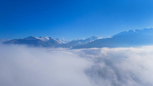 istock Breathtaking mountain landscape with a thick layer of clouds 2202266595